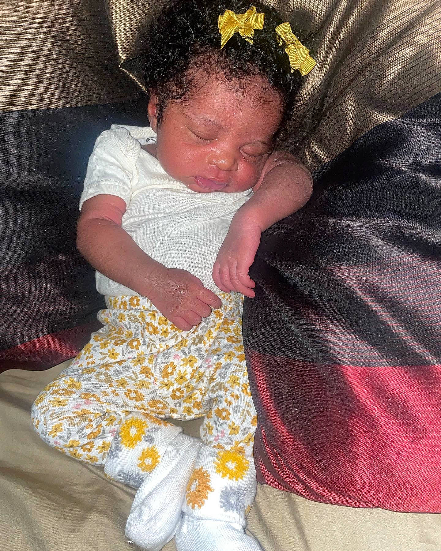 Kimorah is registered to the contest to win money with this photo: baby, baby_products, baby_toddler_clothing, child, comfort, couch, event, foot, fun, happy, headband, jewellery, lap, linens, pattern, person, sitting, sleeve, sock, textile