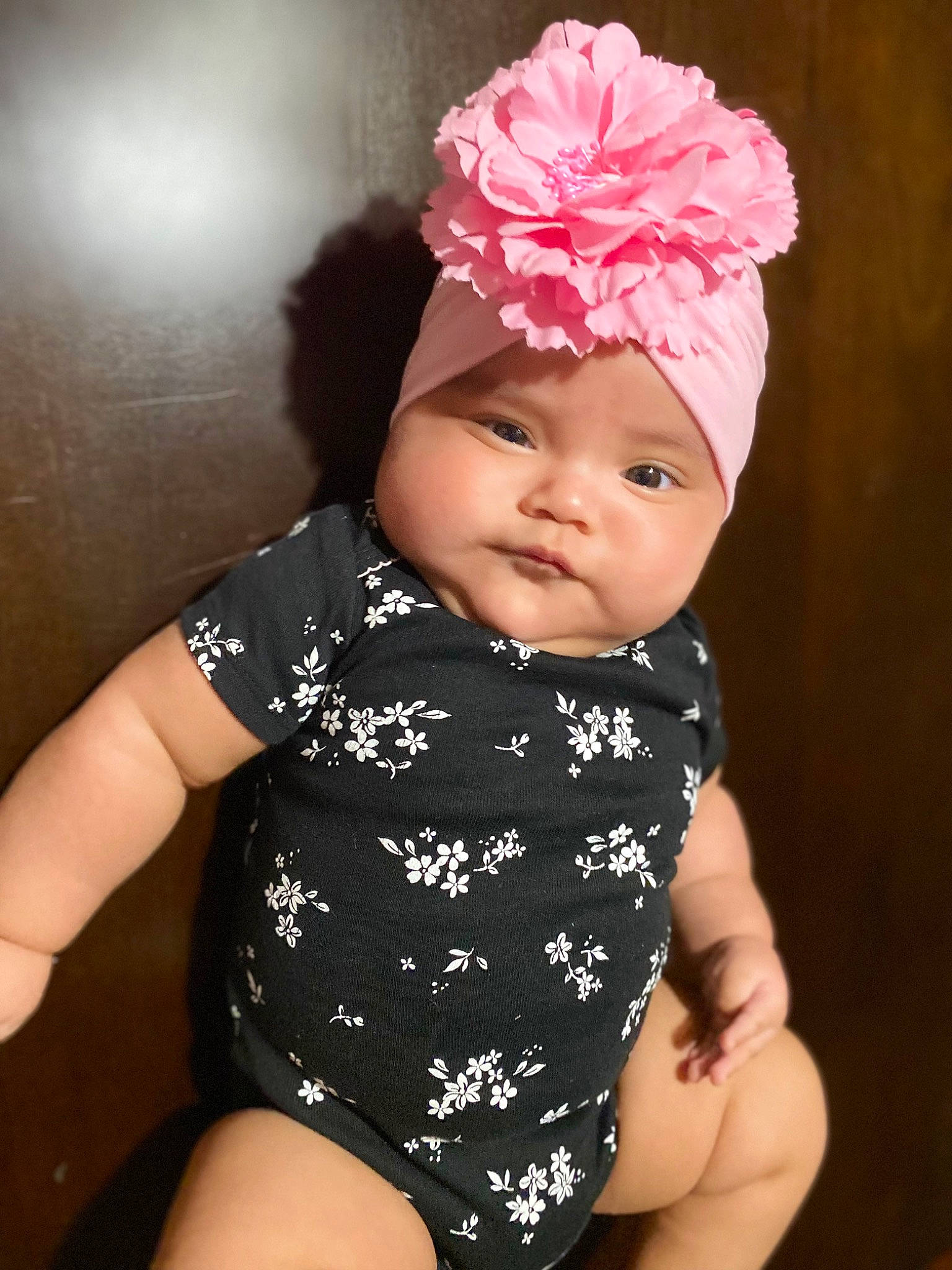 Kinsleigh is registered to the contest to win money with this photo: baby, baby_toddler_clothing, cap, cheek, child, eye, finger, flash_photography, flower, happy, head, headgear, headpiece, headwear, iris, lip, person, petal, pink, skin