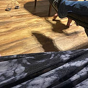Zyla is registered to the contest to win money with this photo: child, legs, feet, wooden_floor, chair, footwear, slippers, blanket, shadow, indoor, crawling, adult_foot, jeans, shoe, flooring, furniture, casual, home, person, lighting