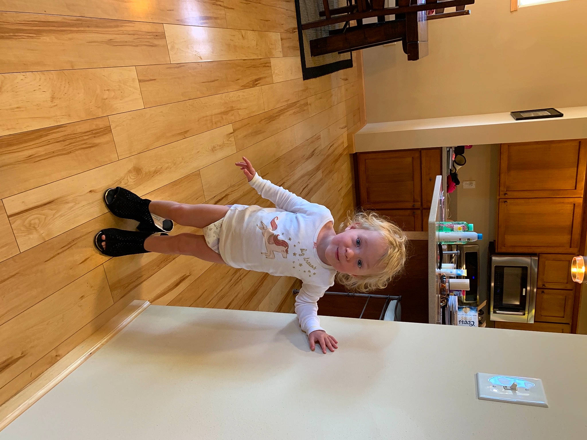 Natasha is registered to the contest to win money with this photo: baby, baby_toddler_clothing, cabinetry, chair, child, floor, flooring, hardwood, house, human_body, interior_design, laminate_flooring, person, smile, stairs, table, toddler, varnish, wood, wood_flooring