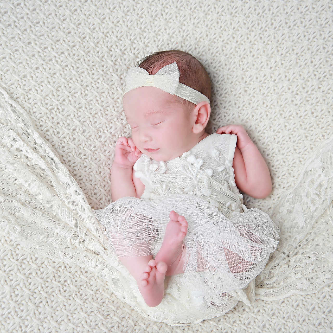 Isobel is registered to the contest to win money with this photo: baby, bed, bedroom, blanket, bodypart, bonnet, clothing, dress, face, finger, furniture, hand, hat, head, lace, newborn, person, photography, portrait, sleeping