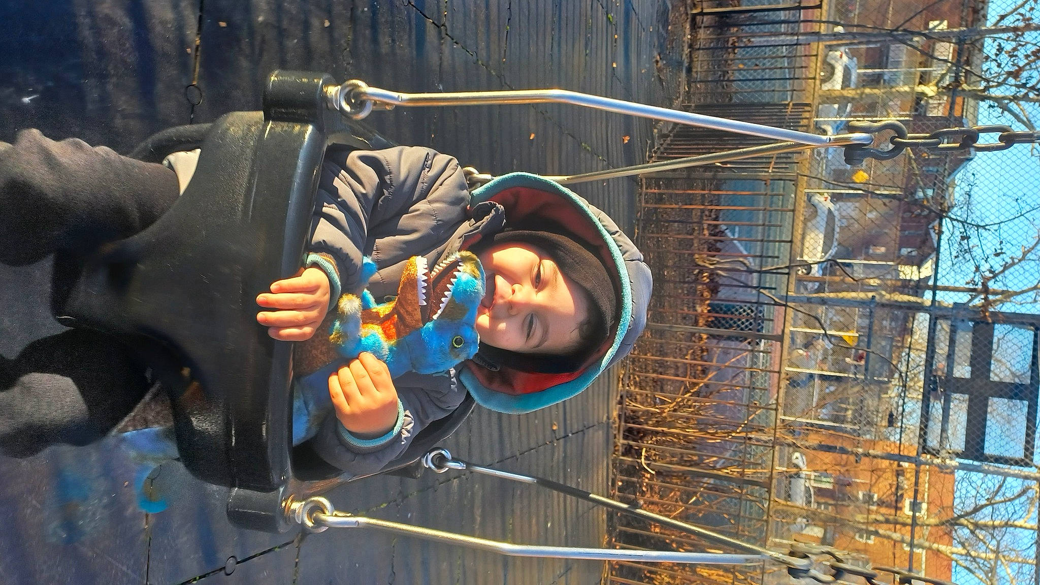 Antonio is registered to the contest to win money with this photo: adventure, blue_collar_worker, camera, child, fun, hat, headgear, helmet, jacket, leisure, metal, person, personal_protective_equipment, recreation, rope, smile, sun_hat, toddler, winter, wire