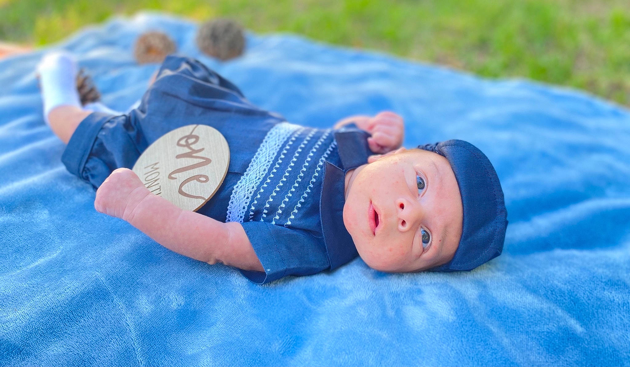 Zayn joined the competition — help win amazing prizes! baby, baby_toddler_clothing, blue, child, electric_blue, eye, fun, grass, hand, happy, hat, headgear, headwear, human_body, leisure, mammal, people_in_nature, person, plant, toddler