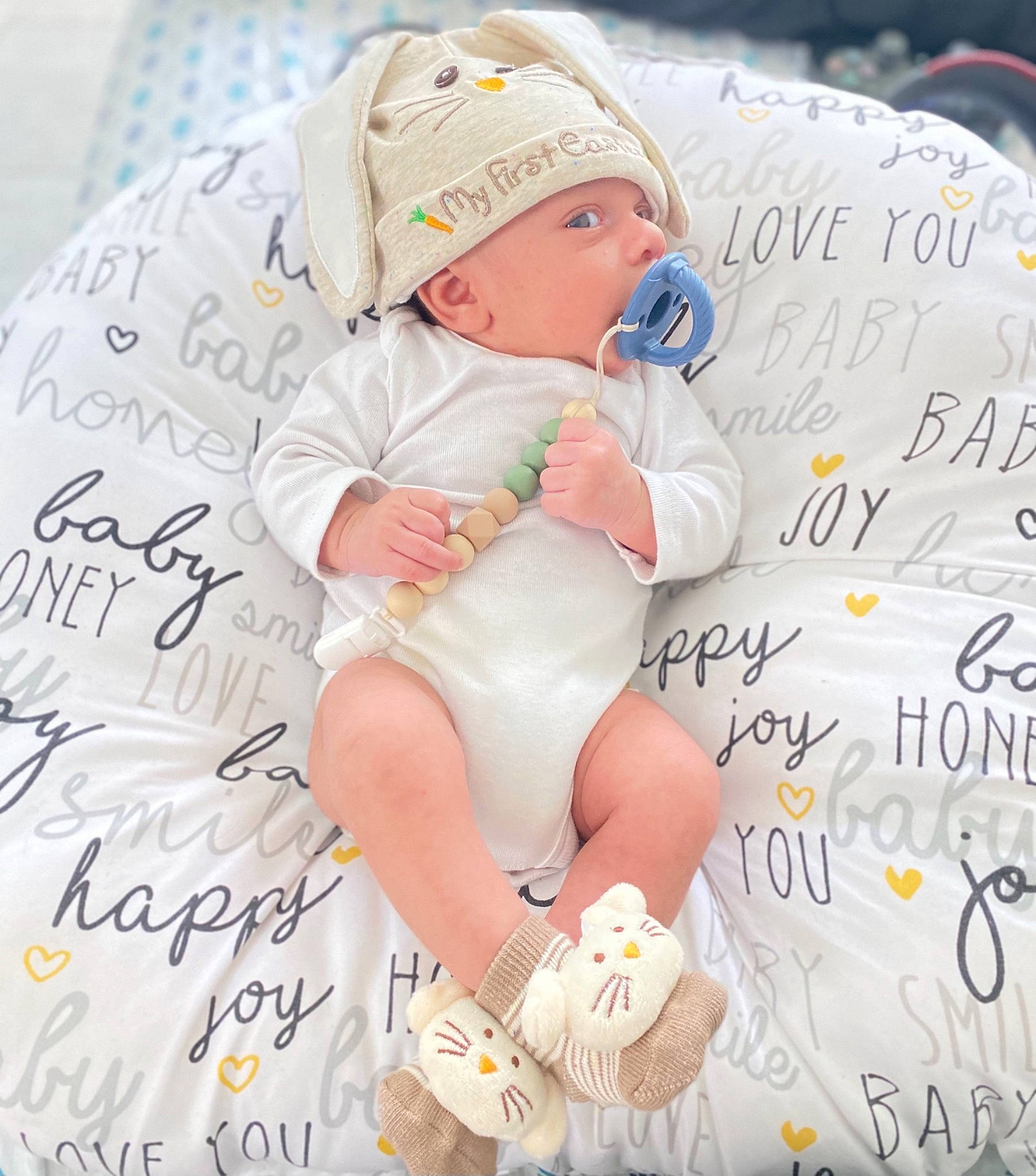 Zayn joined the competition — help win amazing prizes! baby, baby_products, baby_toddler_clothing, baseball_cap, beauty, cap, child, comfort, font, happy, headwear, human_leg, linens, pattern, people, person, photo_caption, pink, sitting, thigh