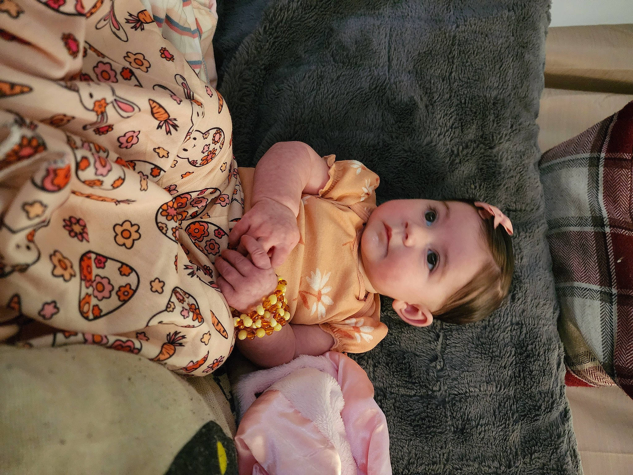 Alora joined the competition — help win amazing prizes! baby, baby_products, baby_toddler_clothing, cheek, child, comfort, couch, doll, dress, eye, eyelash, linens, pattern, person, room, sitting, skin, sleeve, tartan, toddler