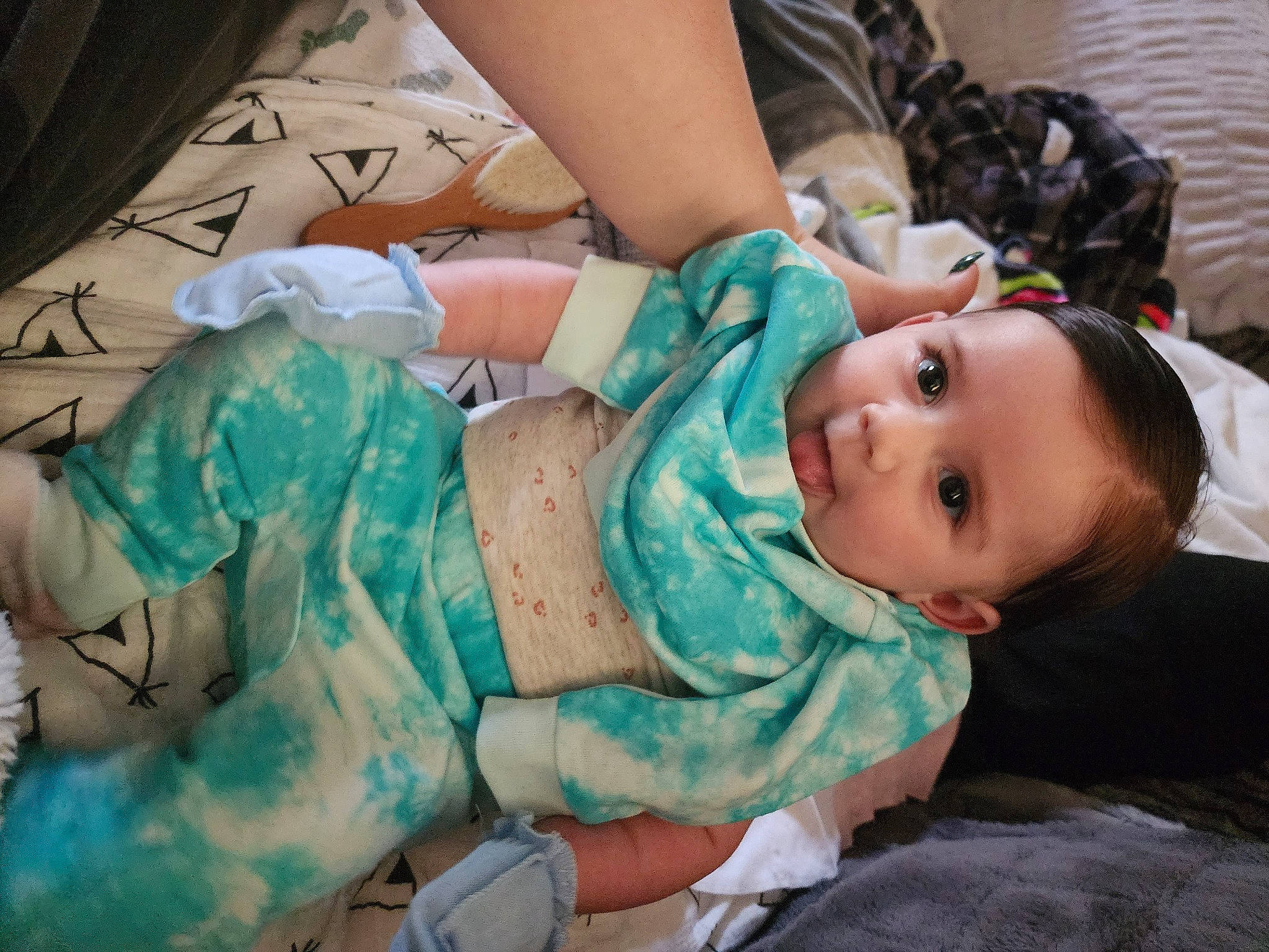 Alora is registered to the contest to win money with this photo: abdomen, baby, baby_products, baby_toddler_clothing, cheek, chest, child, comfort, fun, happy, human_leg, lap, mouth, nail, pattern, person, sitting, skin, thigh, toddler