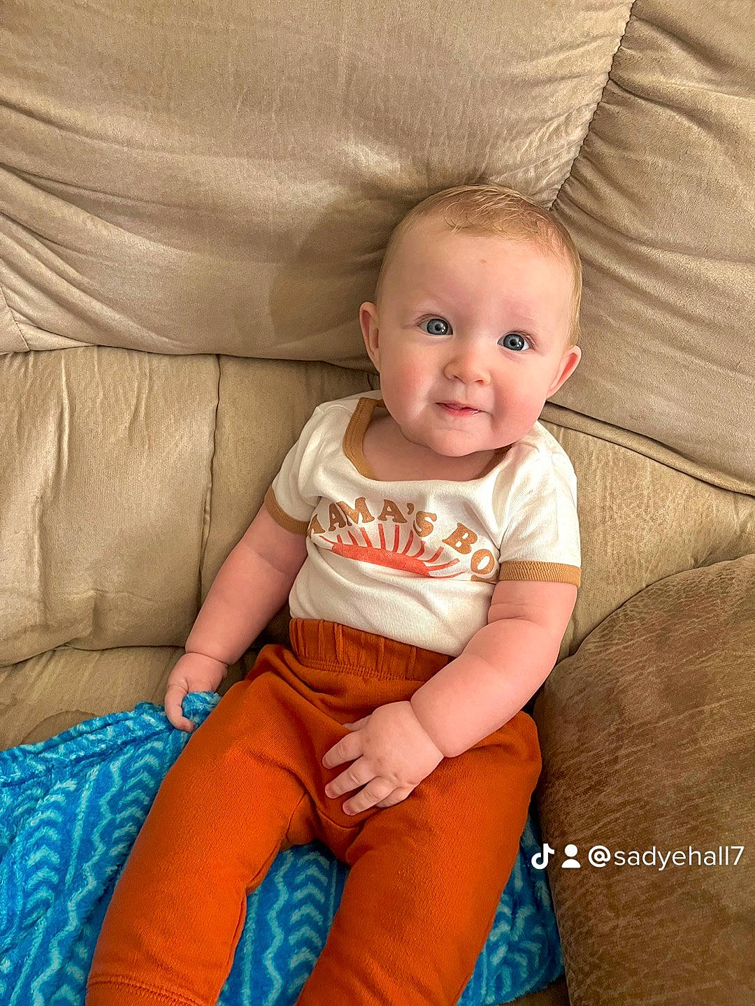 Bowen joined the competition — help win amazing prizes! baby, baby_toddler_clothing, blond, cheek, child, comfort, couch, finger, happy, human_leg, knee, lap, person, shorts, sitting, skin, sleeve, smile, thigh, toddler