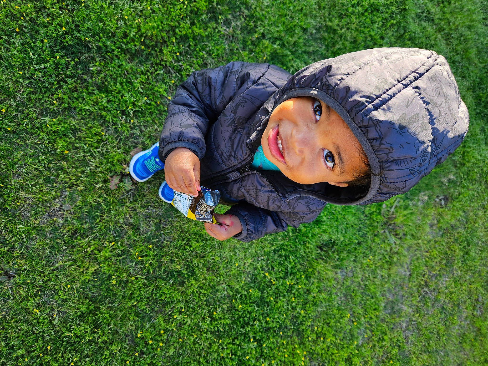 Malakai joined the competition — help win amazing prizes! electric_blue, fun, garden, grass, grass_family, grassland, groundcover, happy, headwear, landscape, lawn, leisure, meadow, natural_environment, people_in_nature, person, plant, recreation, sitting, smile