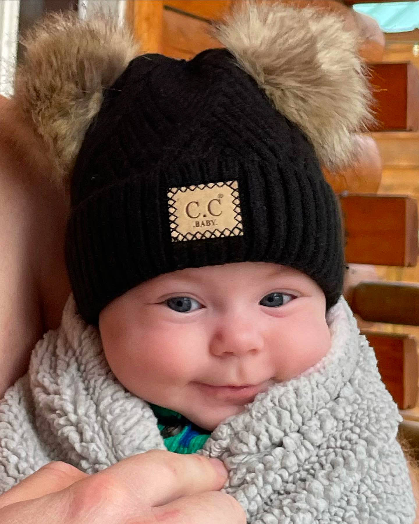Scarlett is registered to the contest to win money with this photo: baby, baby_toddler_clothing, cap, cheek, child, chin, eye, gesture, happy, hat, head, headgear, headwear, knit_cap, lip, outerwear, person, textile, toddler, white