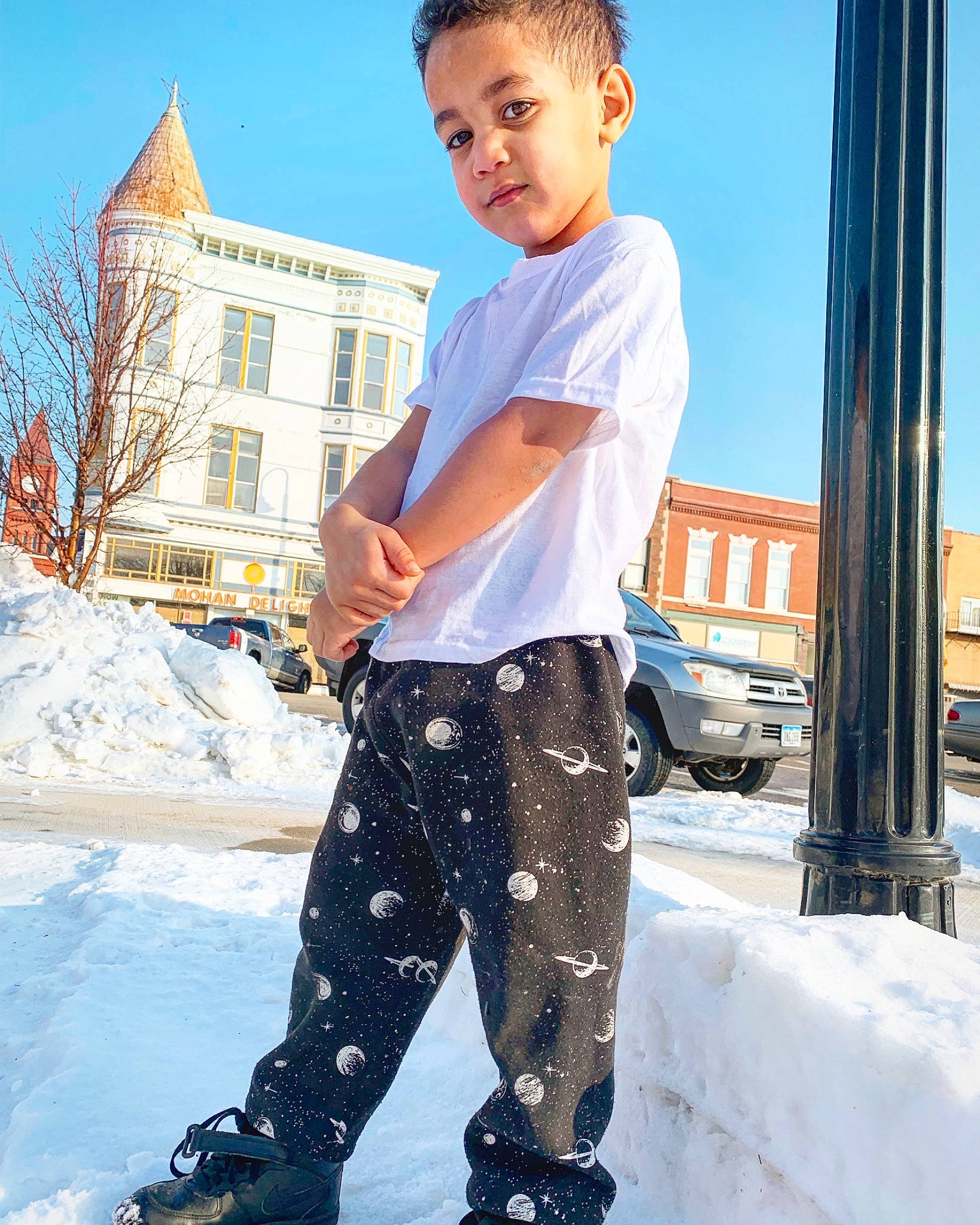 Tyrone Marshall Jr is registered to the contest to win money with this photo: child, child_model, clothing, cool, denim, footwear, jeans, male, outerwear, person, shoe, snow, sportswear, street_fashion, sweatpant, t_shirt, textile, trousers, winter