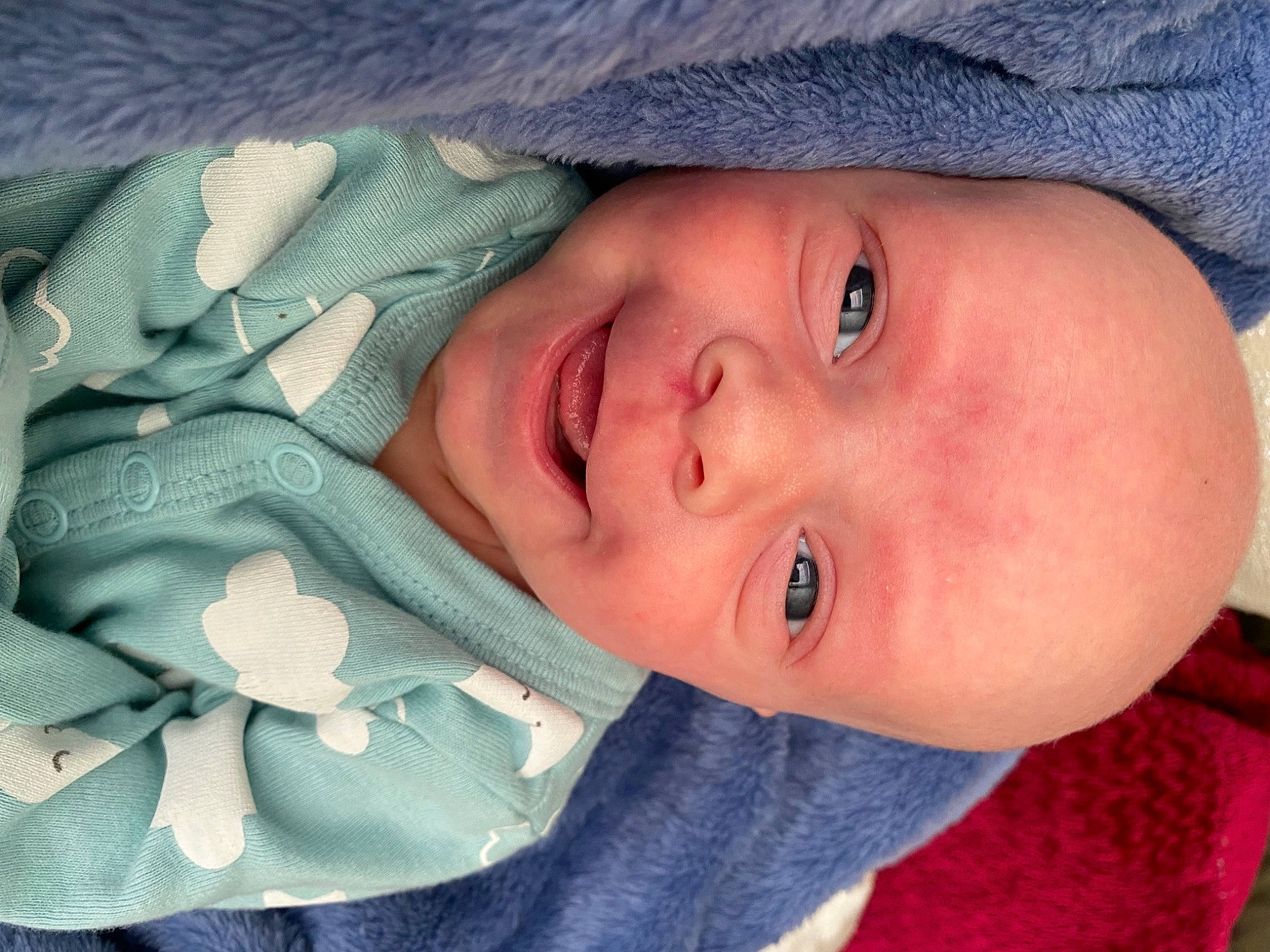 Huxley is registered to the contest to win money with this photo: azure, baby, baby_toddler_clothing, cheek, chin, eye, eyebrow, eyelash, face, head, human_body, iris, lip, mouth, neck, nose, person, product, skin, smile
