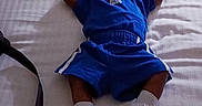 Jayden joined the competition — help win amazing prizes! baby, pacifier, blue_clothing, blanket, bed, sleeping, infant, footwear, white_shoes, toddler, person, indoors, resting, child, soft_lighting, fabric, casual_wear, human, blanket_pattern, comfort