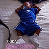 baby, pacifier, blue_clothing, blanket, bed, sleeping, infant, footwear, white_shoes, toddler, person, indoors, resting, child, soft_lighting, fabric, casual_wear, human, blanket_pattern, comfort