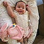 Florence joined the competition — help win amazing prizes! baby, blanket, child, clothing, comfort, cute, face, happy, home, indoor, infant, lying_down, onesie, person, pink, playful, plush_toy, smiling, sock, soft_toy