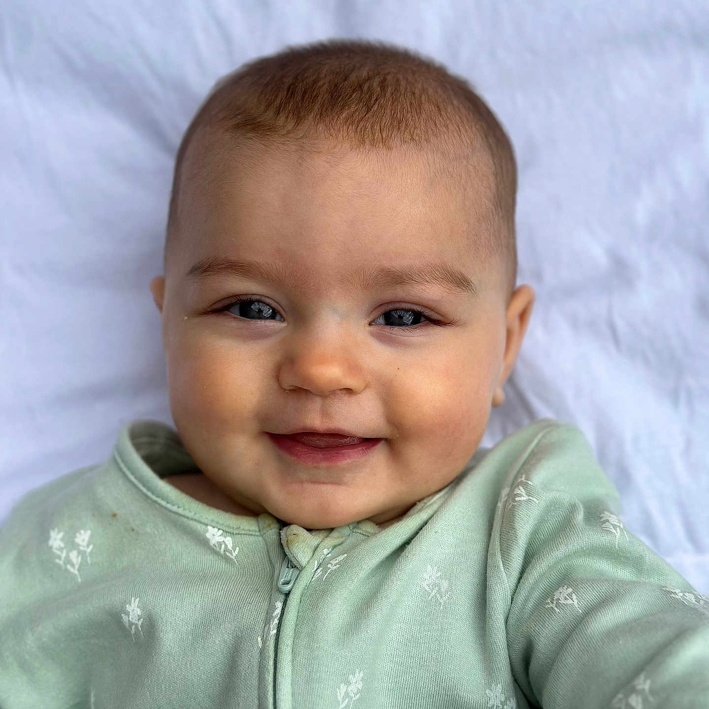 Romany is registered to the contest to win money with this photo: baby, babylaughing, bodypart, clothing, coat, face, happy, head, jacket, knitwear, laughing, mouth, newborn, person, photography, portrait, selfie, shirt, smile, teeth