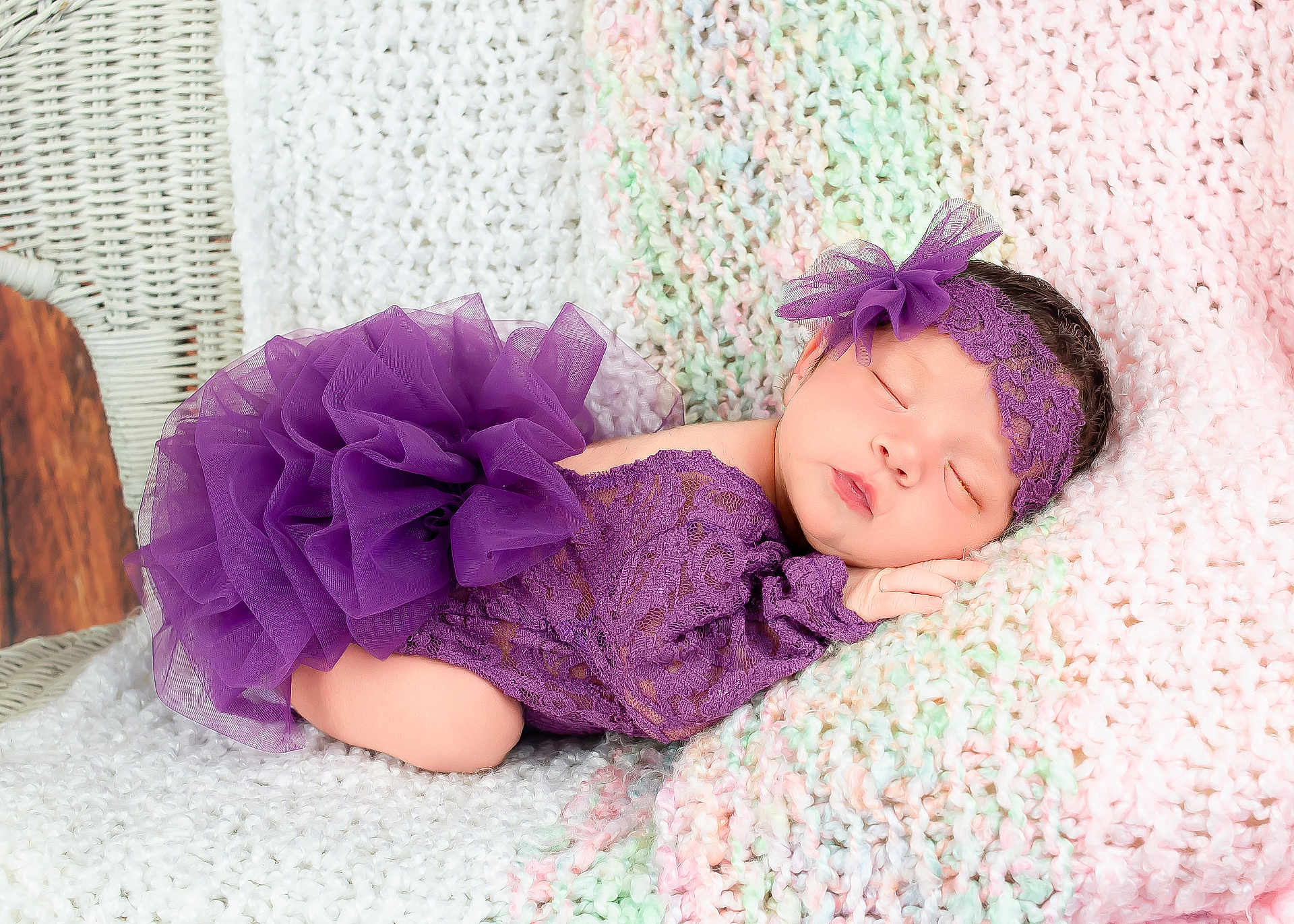 Carina is registered to the contest to win money with this photo: newborn, baby, sleeping, purple_lace, headband, knitted_blanket, pastel_colors, wicker_chair, soft_texture, portrait, infant, cute, peaceful, resting, closeup, delicate, indoors, fabric, tulle, face