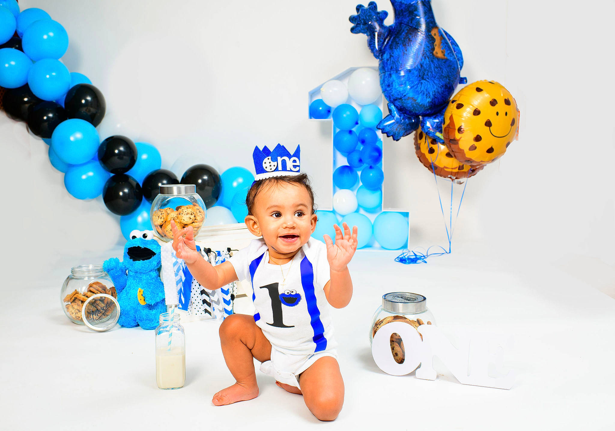 Sean is registered to the contest to win money with this photo: animation, art, azure, baby, baby_products, baby_toddler_clothing, baby_toys, blue, electric_blue, event, font, fun, gesture, graphics, happy, party_supply, person, product, room, smile