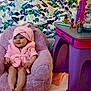 Izabella is registered to the contest to win money with this photo: baby, infant, child, pink_robe, plush_chair, toy_vanity, nail_polish, makeup_items, blanket, floral_pattern, smile, cozy, indoor, hooded_towel, cute, portrait, legs, bare_feet, playset, colorful