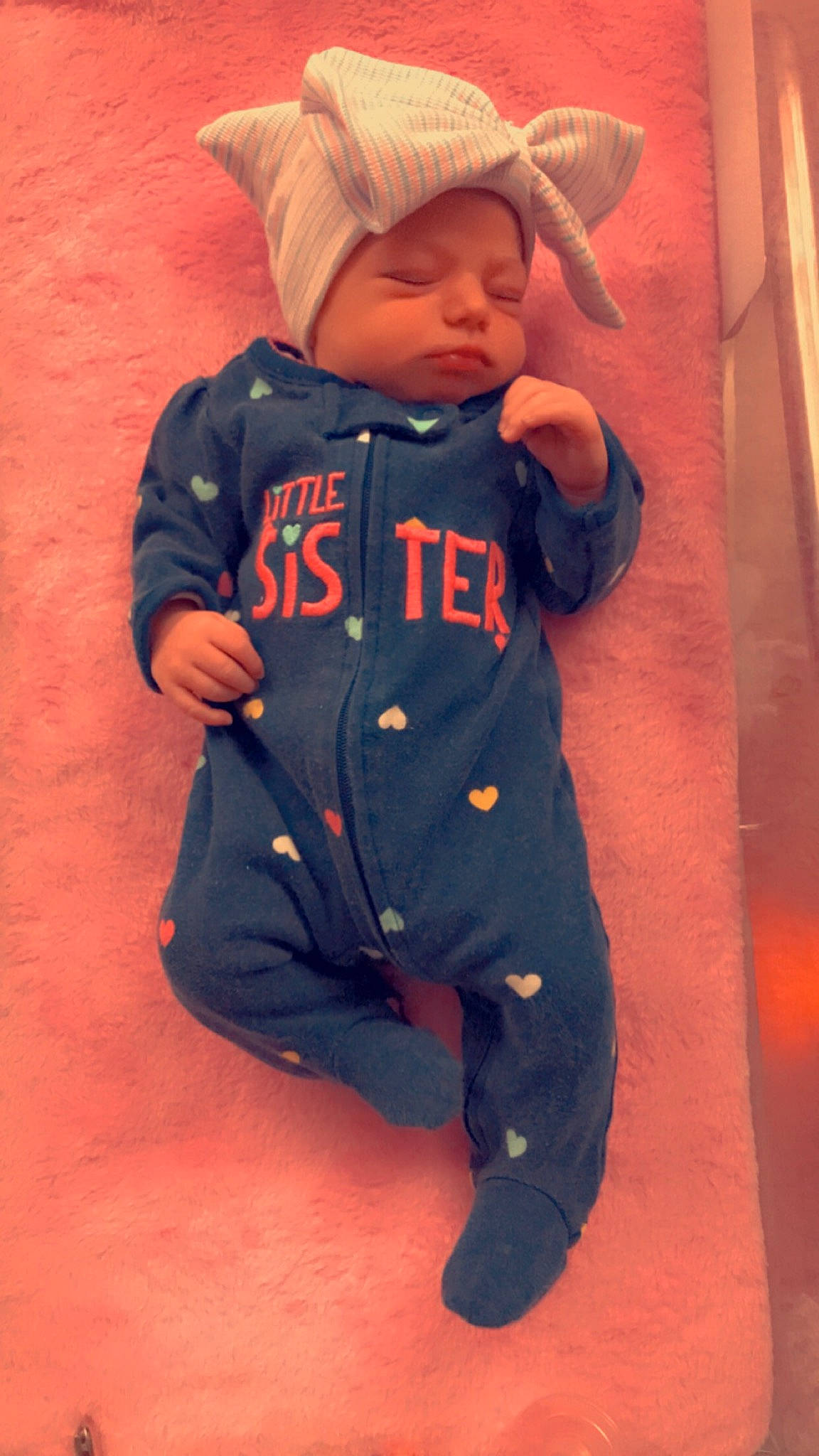 Xaylee is registered to the contest to win money with this photo: baby, baby_products, baby_toddler_clothing, carmine, child, costume, electric_blue, face, fashion_accessory, fur, happy, hat, headwear, hood, jacket, pattern, person, personal_protective_equipment, sitting, sleeve