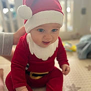 Emil participe au concours pour gagner de l'argent avec cette photo : baby, blue_eyes, child, christmas, cozy, cute, festive, hand_support, holiday, holiday_costume, indoor, infant, mat, portrait, red_clothing, santa_hat, sitting, smiling, soft_focus, young_child