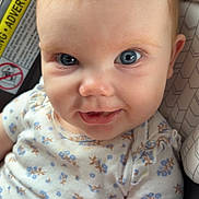 Havery Grace is registered to the contest to win money with this photo: baby, child, blue_eyes, smile, onesie, car_seat, infant, cute, face, skin, hair, clothing, sitting, indoors, portrait, person, closeup, happy, small_hands, seat
