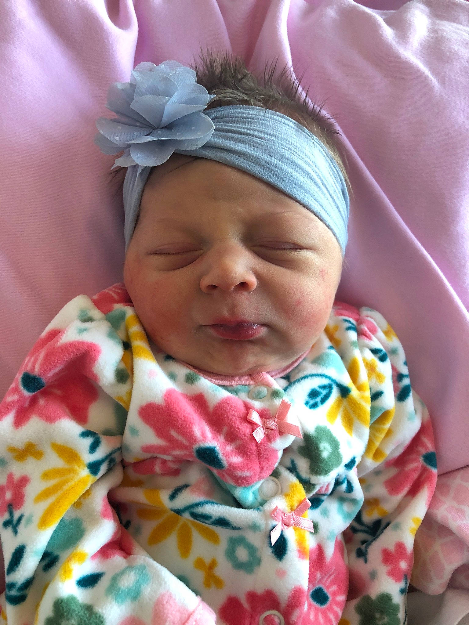 Kynley is registered to the contest to win money with this photo: baby, cheek, child, close_up, eye, face, forehead, hair_accessory, happy, head, headband, headgear, lip, mouth, nose, person, pink, skin, smile, textile