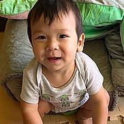 Nolan is registered to the contest to win money with this photo: baby, babycrawling, babylaughing, crawling, cushion, face, happy, head, homedecor, person, photography, portrait, sitting, smile