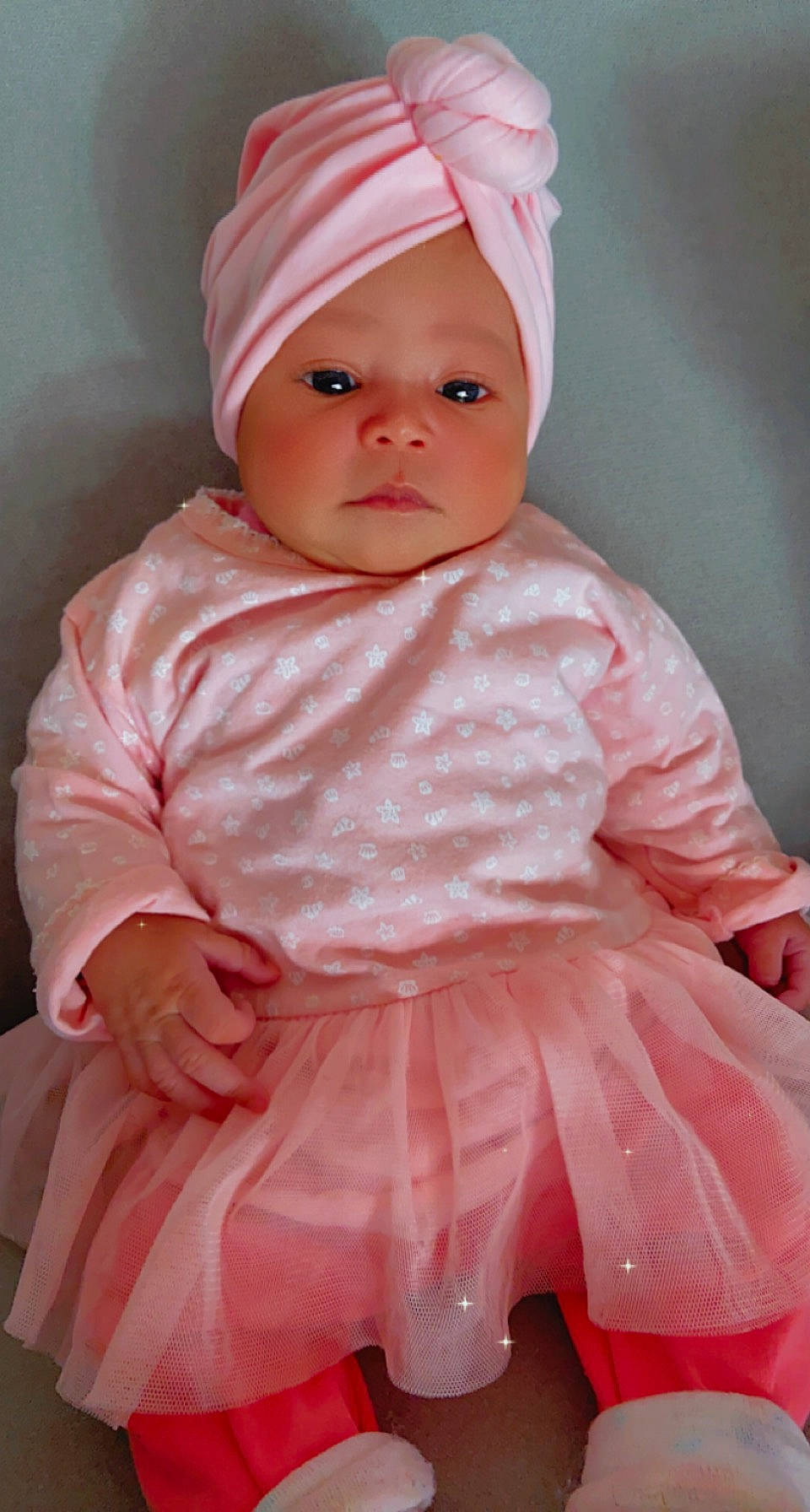 Lindsay participe au concours pour gagner de l'argent avec cette photo : baby, baby_toddler_clothing, cap, cheek, chin, clothing, dress, eye, face, head, headwear, human_body, lip, one_piece_garment, outerwear, person, pink, skin, sleeve, textile