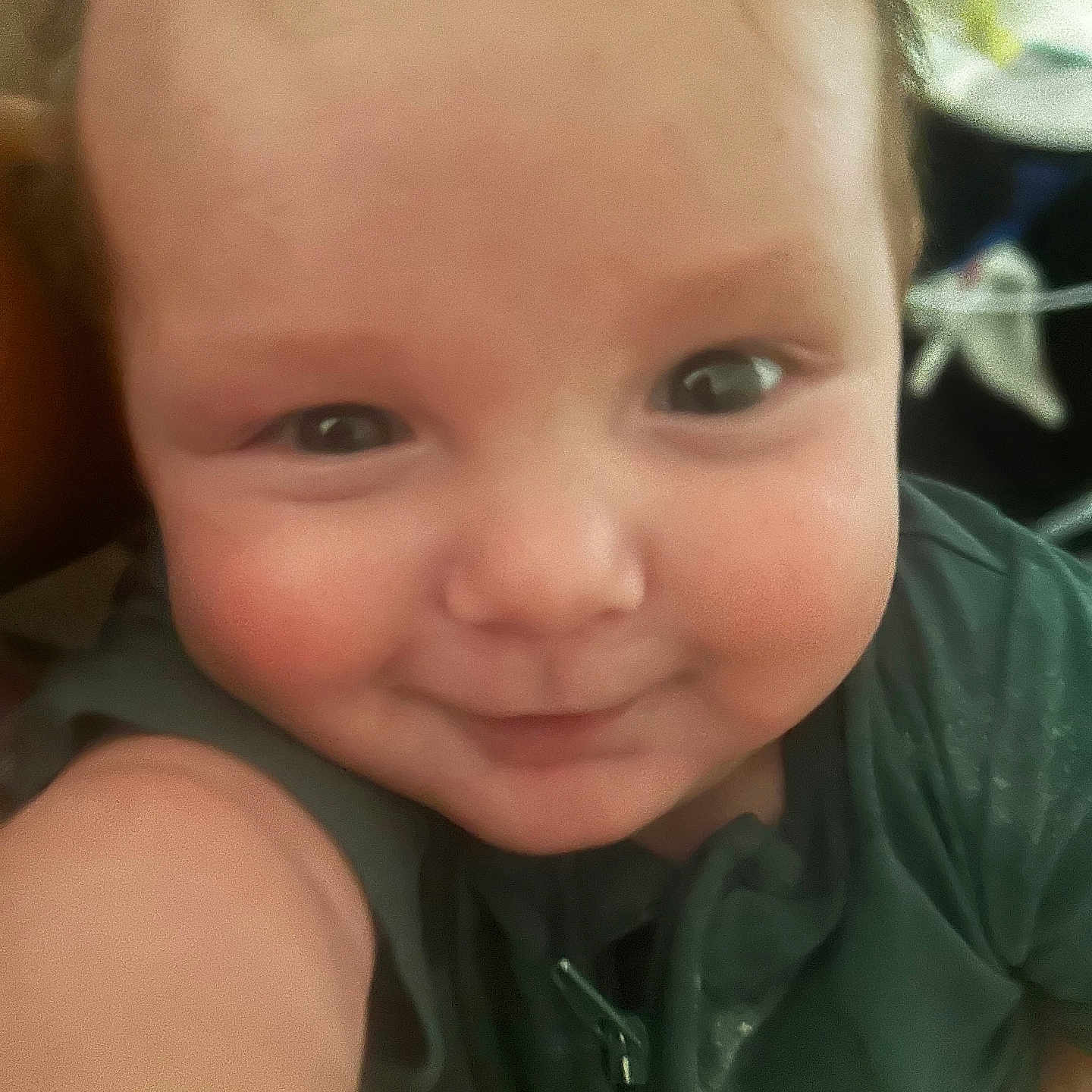 Kessler joined the competition — help win amazing prizes! baby, baby_garment, child, chubby_cheeks, close_up, cute, expression, eyes, face, green_clothing, happy, head, indoor, infant, person, portrait, selfie, skin, smile, young_child