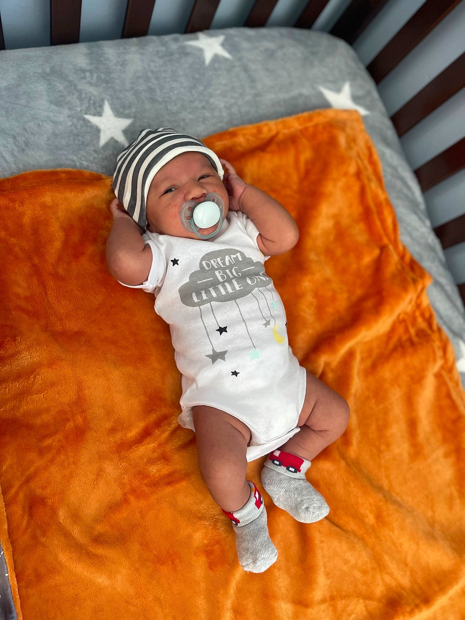 Damian joined the competition — help win amazing prizes! baby, baby_products, baby_sleeping, baby_toddler_clothing, child, comfort, costume, fictional_character, flooring, hardwood, hat, headwear, linens, orange, person, personal_protective_equipment, room, sleeve, t_shirt, toddler