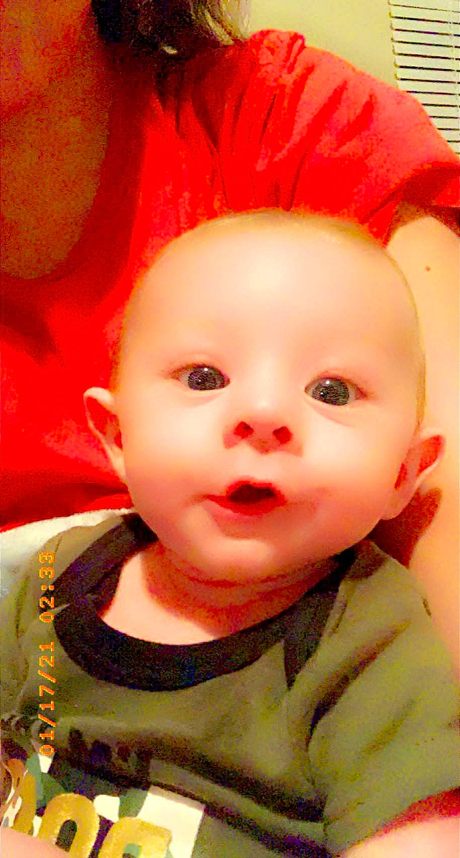 Buddy is registered to the contest to win money with this photo: baby, baby_toddler_clothing, cheek, child, chin, coquelicot, costume_accessory, eye, eyebrow, eyelash, forehead, hair_coloring, iris, lip, organ, peach, person, pink, red, skin