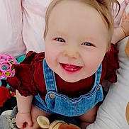 Julia participe au concours pour gagner de l'argent avec cette photo : baby, smiling, child, denim_overalls, maroon_shirt, toys, stuffed_animals, indoor, happy, cute, face, blue_eyes, infant, playtime, soft_toys, cheerful, closeup, skin, person, sitting