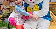 Anna joined the competition — help win amazing prizes! child, girl, easter_bunny, costume, bench, hug, smile, outdoor, spring, flowers, holiday, celebration, person, happy, festive, plush, colorful, background, fun, event