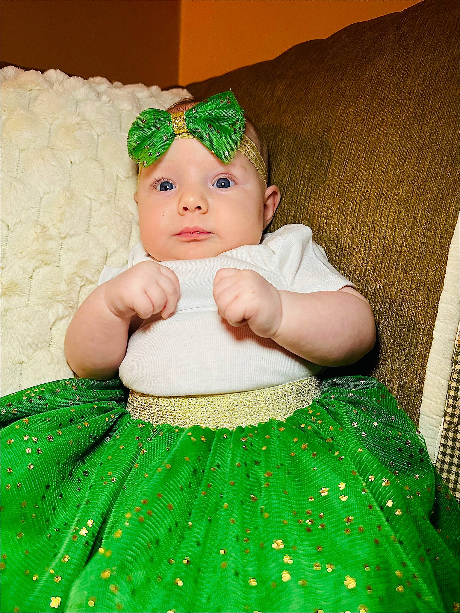 Winter is registered to the contest to win money with this photo: baby, baby_products, baby_toddler_clothing, cheek, child, day_dress, fashion_accessory, grass, green, happy, headband, headwear, iris, jewellery, linens, one_piece_garment, pattern, person, ruffle, skin