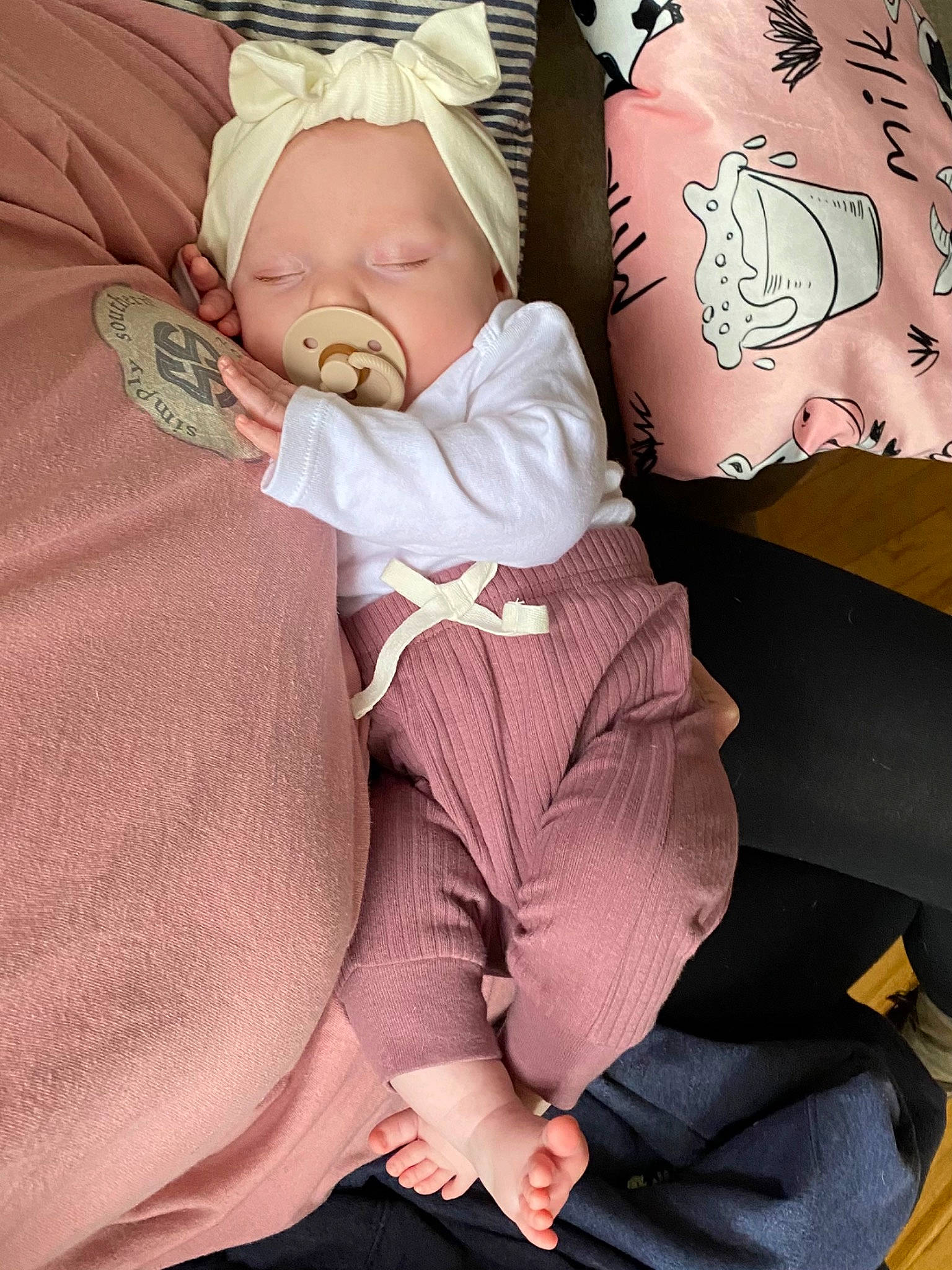 Winter is registered to the contest to win money with this photo: abdomen, baby, baby_products, baby_sleeping, baby_toddler_clothing, cheek, child, comfort, human_body, human_leg, knee, linens, magenta, pattern, person, pink, skin, sleeve, stomach, thigh