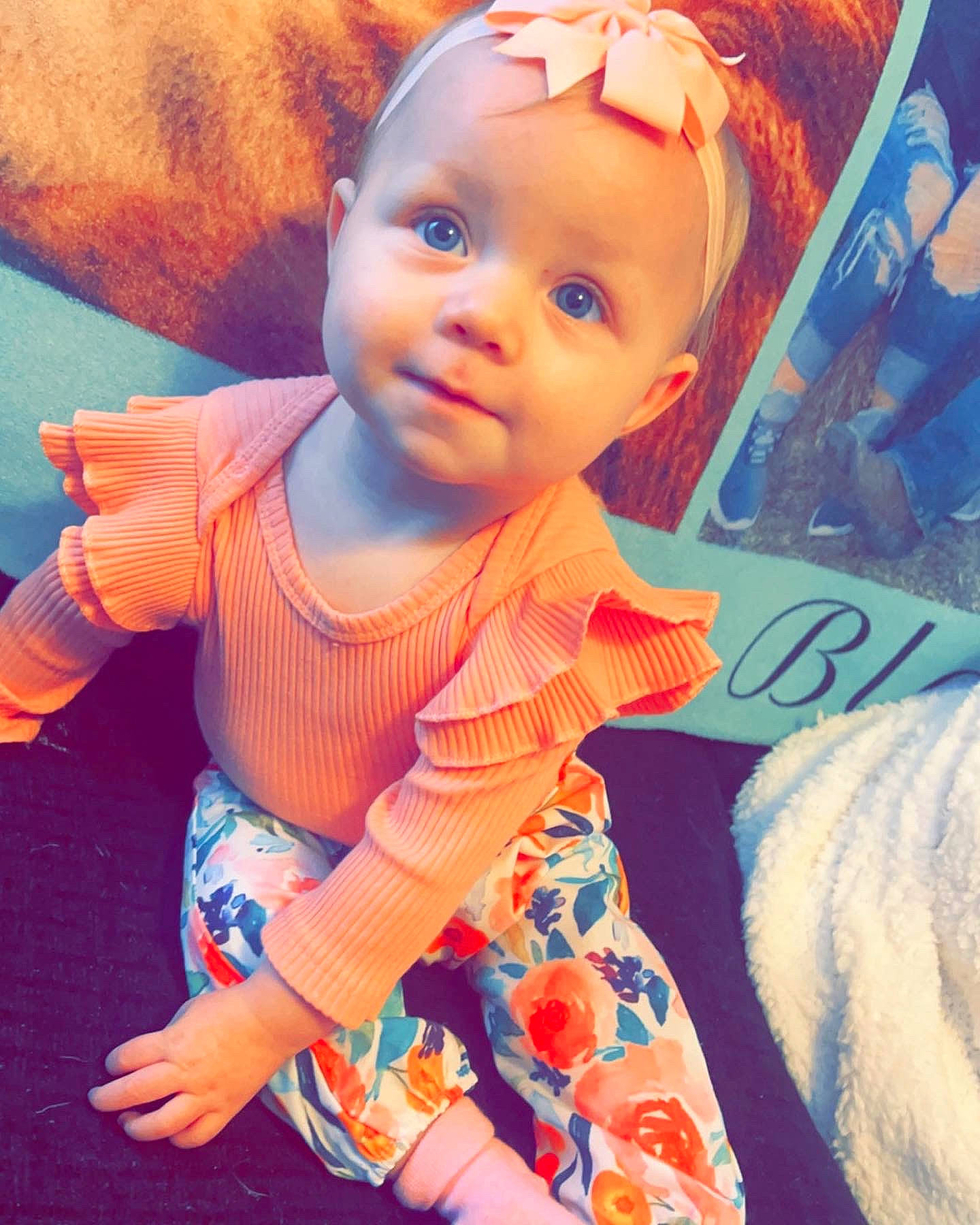 Aleina is registered to the contest to win money with this photo: azure, baby, baby_toddler_clothing, cheek, child, cool, electric_blue, fun, happy, iris, lip, neck, nose, orange, person, pink, skin, sleeve, t_shirt, textile