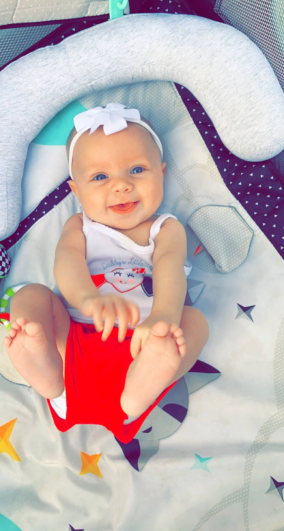 Aleina is registered to the contest to win money with this photo: baby, baby_toddler_clothing, cheek, child, comfort, eye, face, finger, fun, happy, head, headwear, joy, person, pink, product, purple, skin, sleeve, smile