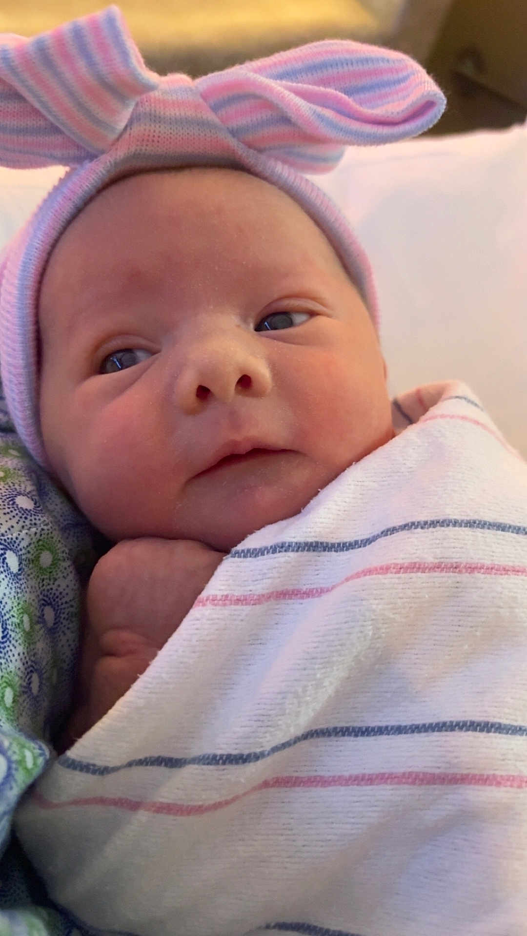 Halo joined the competition — help win amazing prizes! newborn, baby, infant, face, hat, striped_blanket, wrapped, cute, human, skin, eyes, indoors, portrait, headwear, newborn_hat, baby_clothing, lying_down, soft, hospital, resting