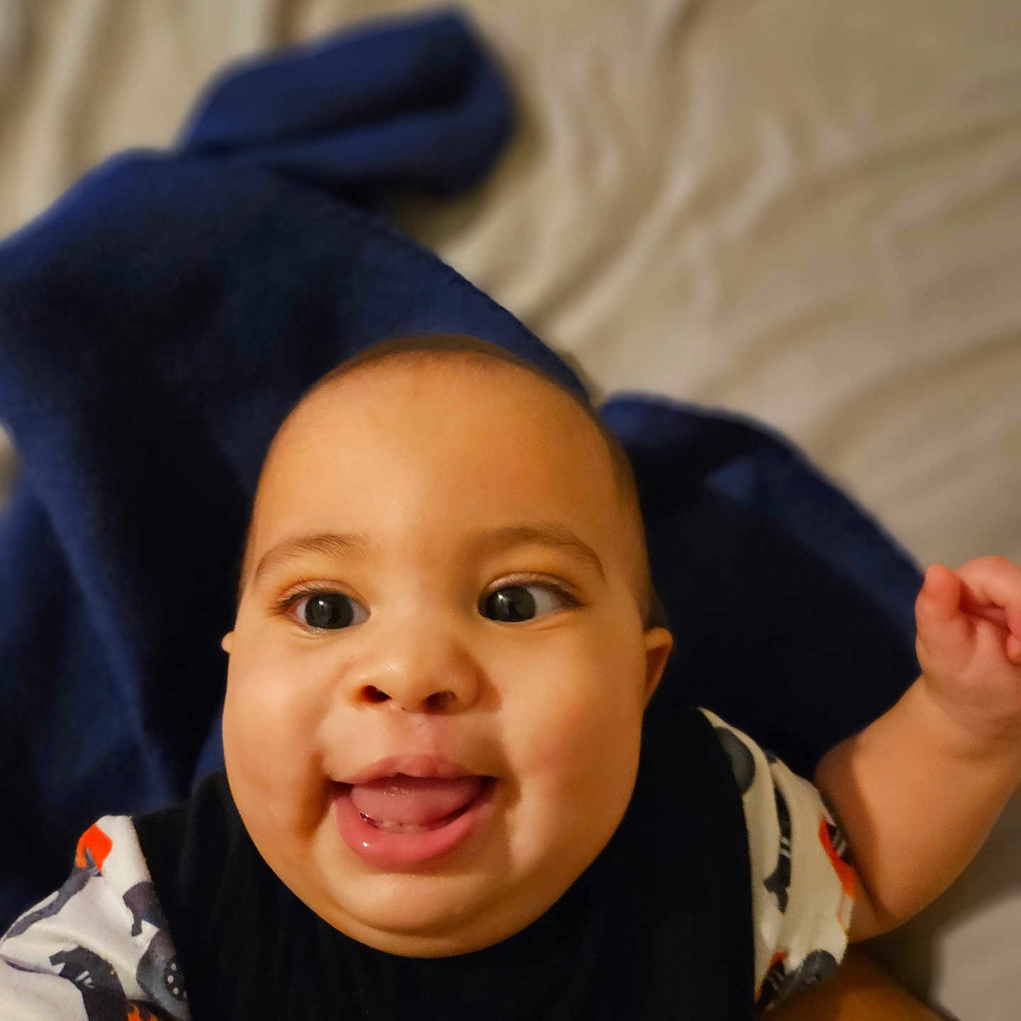 Brysan joined the competition — help win amazing prizes! baby, blanket, blue, child, clothing, cozy, cute, expression, face, hand, happy, indoor, infant, person, playful, portrait, skin, smile, tongue, young