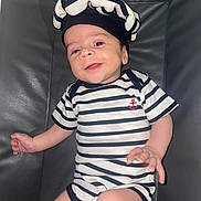 Eden a rejoint le concours — aidez-le/la à gagner de superbes lots ! baby, casual, chair, child, cute, diaper, face, happy, hat, headwear, indoor, infant, leather, legs, nautical, person, portrait, small_hand, smiling, striped_clothing