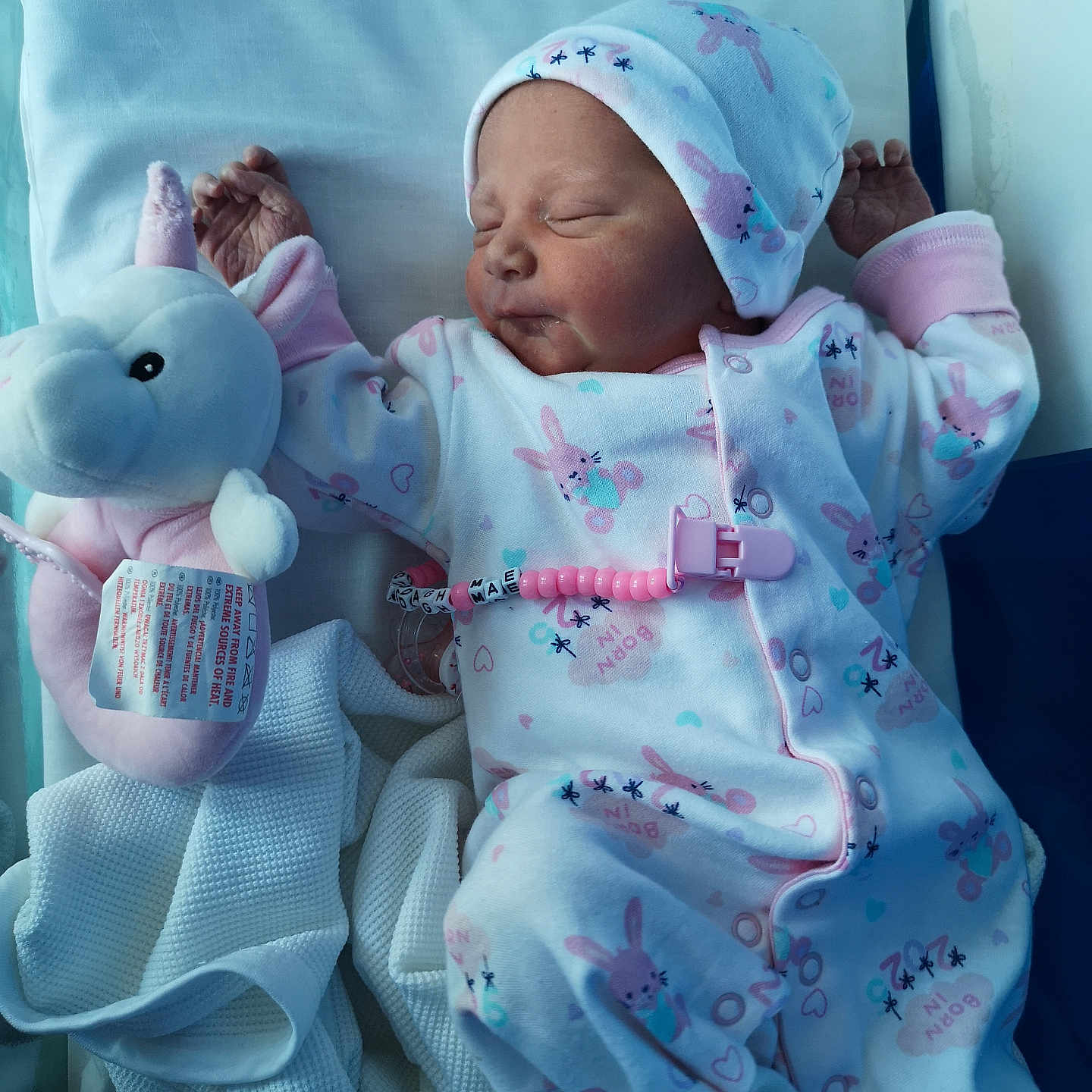 Clodagh-Mae joined the competition — help win amazing prizes! baby, blanket, child, clothing, cute, hat, hospital, indoors, infant, lying_down, newborn, onesie, peaceful, pink, plush_toy, portrait, sleeping, soft_toy, unicorn, white