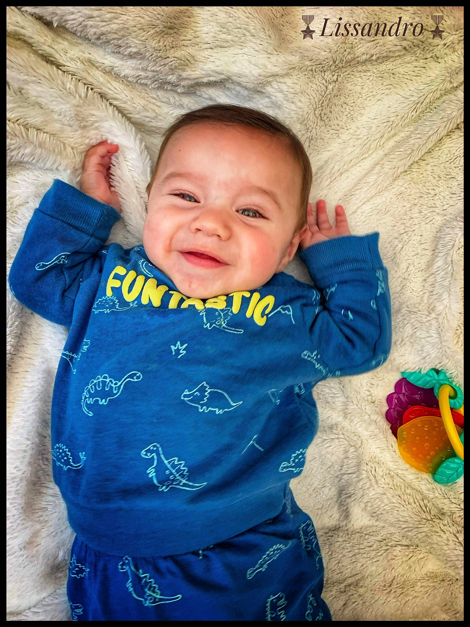 Lissandro participe au concours pour gagner de l'argent avec cette photo : azure, baby, baby_toddler_clothing, cheek, child, electric_blue, facial_expression, flash_photography, happy, magenta, nose, outerwear, pattern, person, product, skin, sleeve, smile, t_shirt, textile