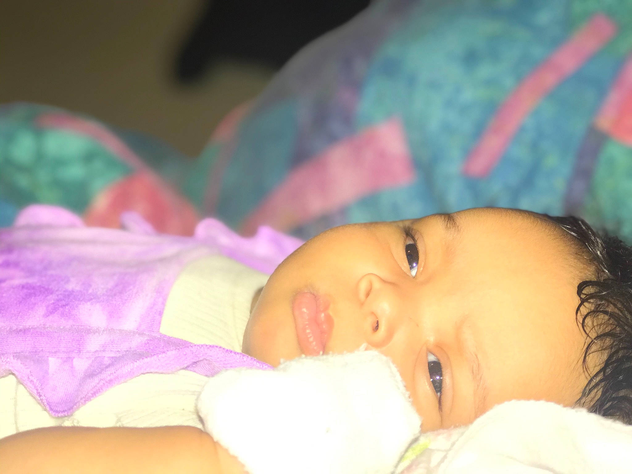 Embry is registered to the contest to win money with this photo: baby, baby_toddler_clothing, bedtime, cheek, child, comfort, eyelash, face, fun, happy, human_body, iris, linens, lip, mouth, nap, nose, person, portrait_photography, skin