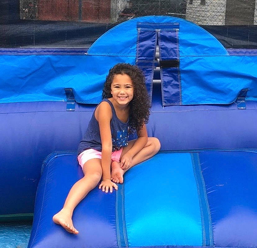 Cherish is registered to the contest to win money with this photo: electric_blue, fun, games, inflatable, joy, leg, leisure, person, recreation, smile, thigh, vacation