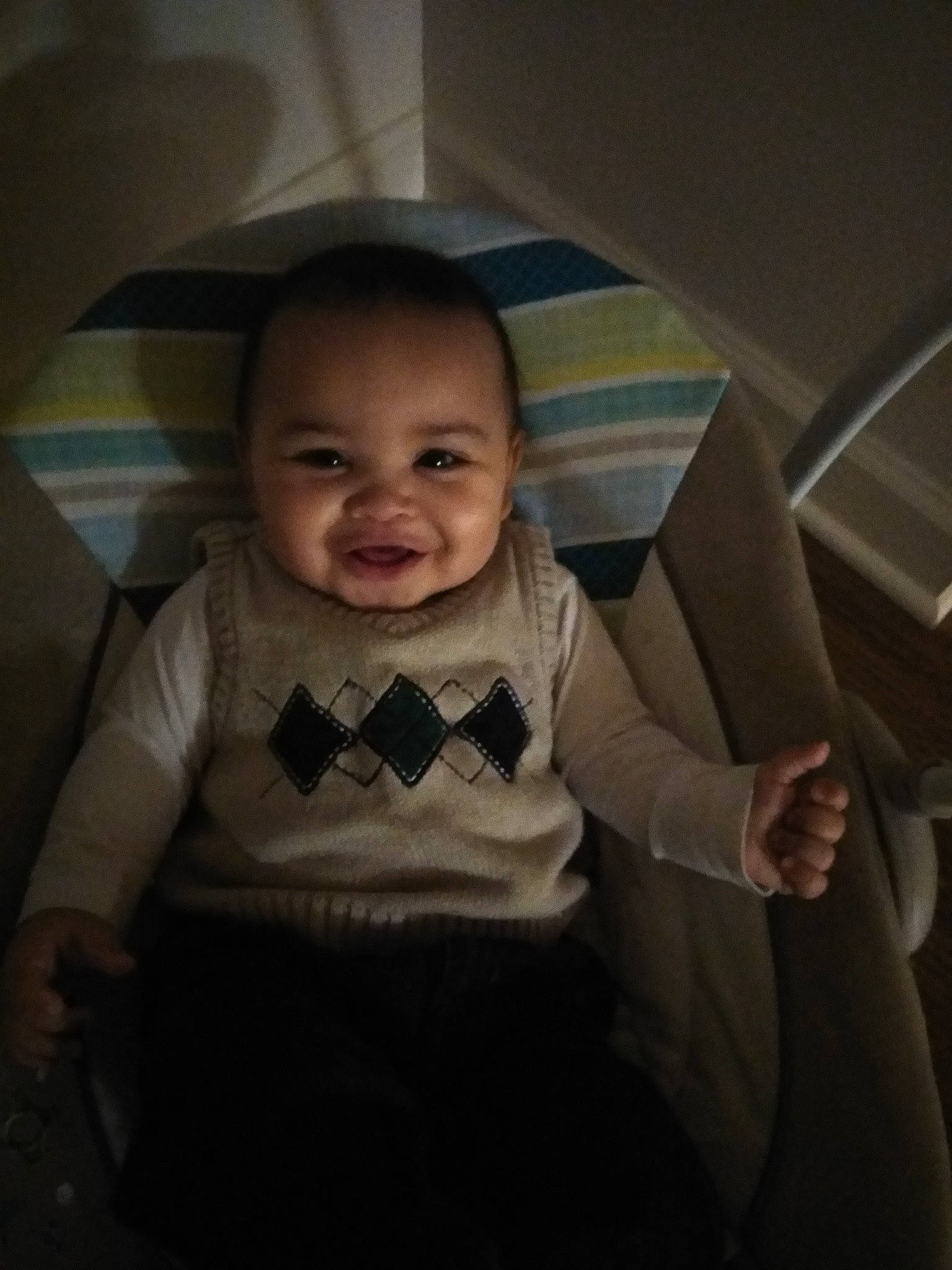 Izayah is registered to the contest to win money with this photo: baby, car_seat, cheek, child, eye, face, facial_expression, fun, head, mouth, person, sitting, skin, smile, standing, toddler, vacation