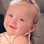 Harley joined the competition — help win amazing prizes! baby, child, smile, face, pink_bow, hair_accessory, infant, cute, portrait, closeup, skin, young_child, cheeks, happy, eyes, head, clothing, soft_lighting, indoors, cozy