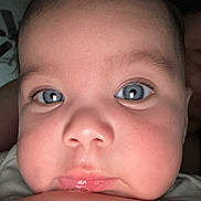 Noah is registered to the contest to win money with this photo: baby, infant, child, face, portrait, close_up, wide_eyes, blue_eyes, serious, funny, indoor, flash_photography, forehead, cheeks, lips, nose, hair, adult_arm, selfie, photography