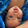 baby, infant, child, portrait, upside_down, blue_blanket, blanket, wide_eyes, open_mouth, lying_down, close_up, face, eyes, nose, lips, skin, cozy, indoor, parent_arm, photography