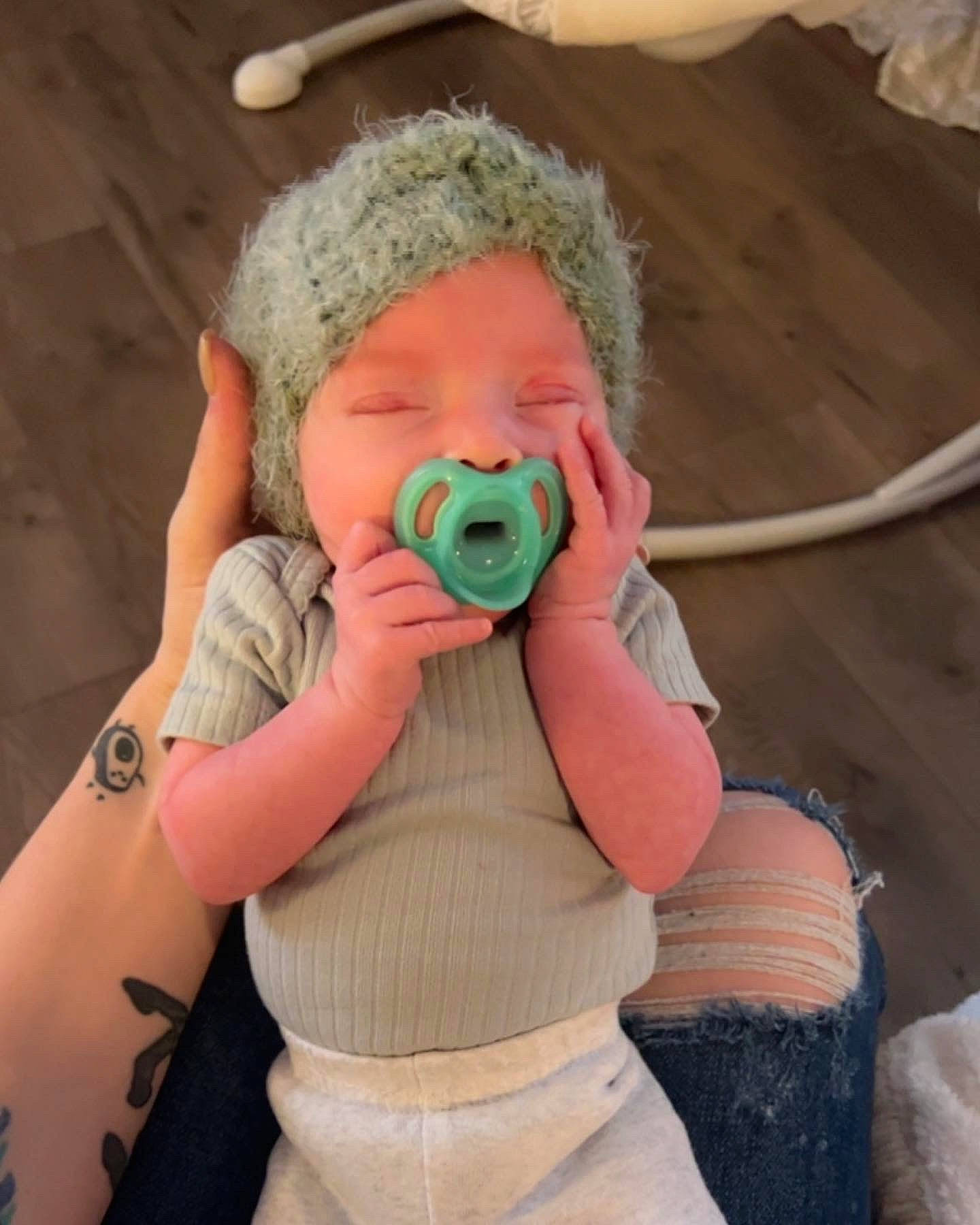 Memphis is registered to the contest to win money with this photo: audio_equipment, baby, baby_products, baby_toddler_clothing, beanie, cap, child, comfort, cool, finger, happy, headgear, pattern, person, personal_protective_equipment, pink, sitting, skin, sleeve, stuffed_toy