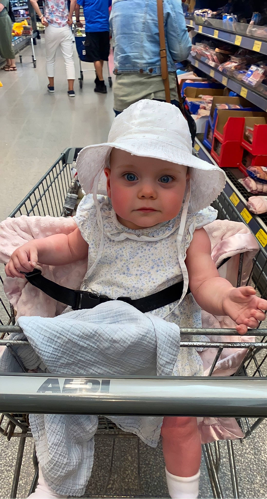 Veronica-bleu is registered to the contest to win money with this photo: baby, baby_carriage, baby_products, cap, chair, child, event, facial_expression, fashion_accessory, fun, happy, hat, headwear, human, leisure, person, shopping, sitting, skin, toddler